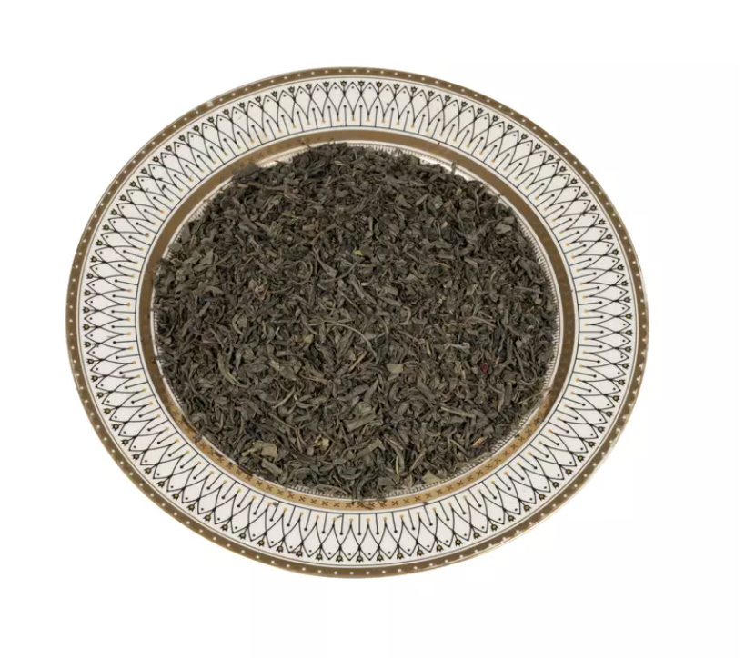 "Freshly brewed Chunmee Green Tea in a teacup, showcasing its vibrant color and rich texture."